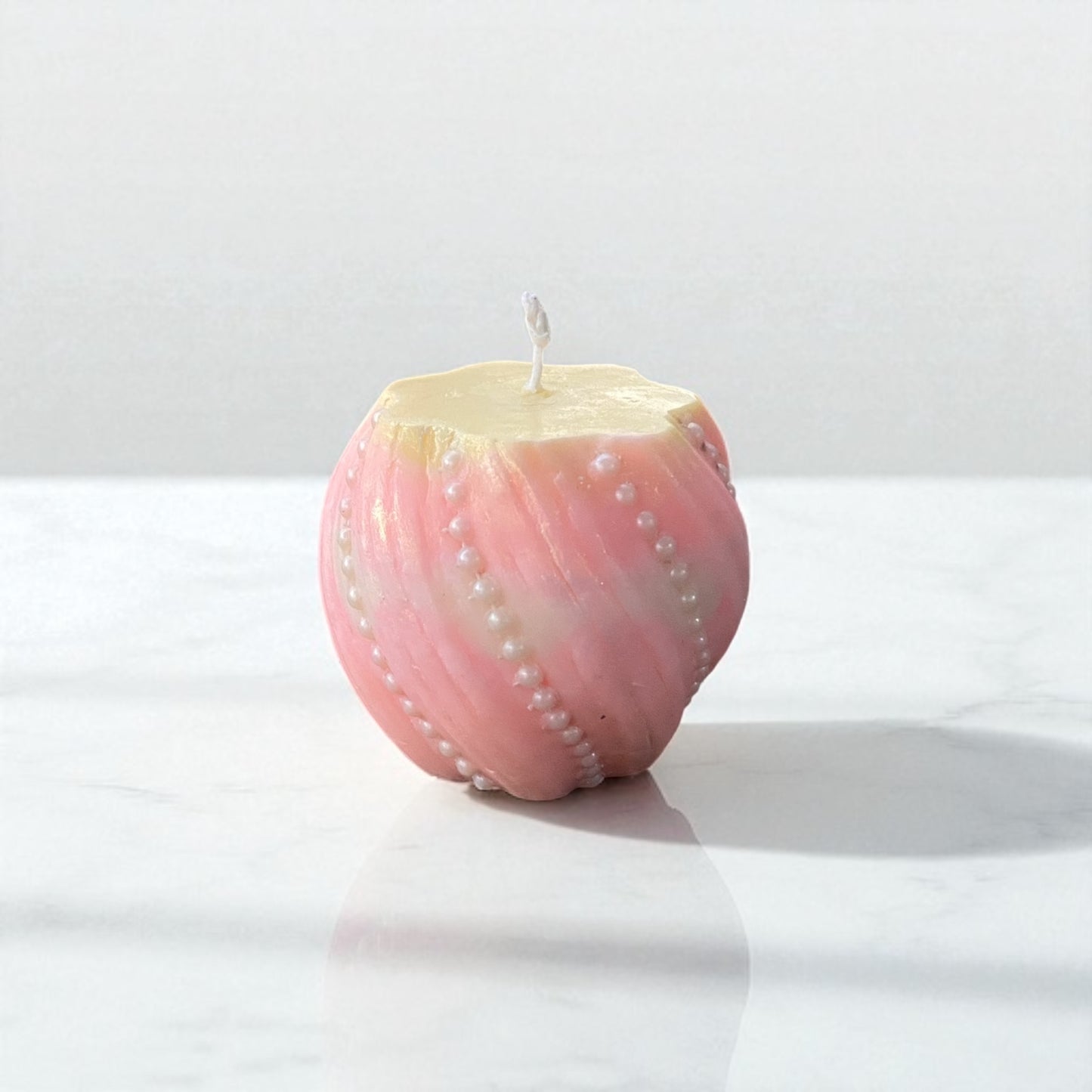 Vela redonda perlada