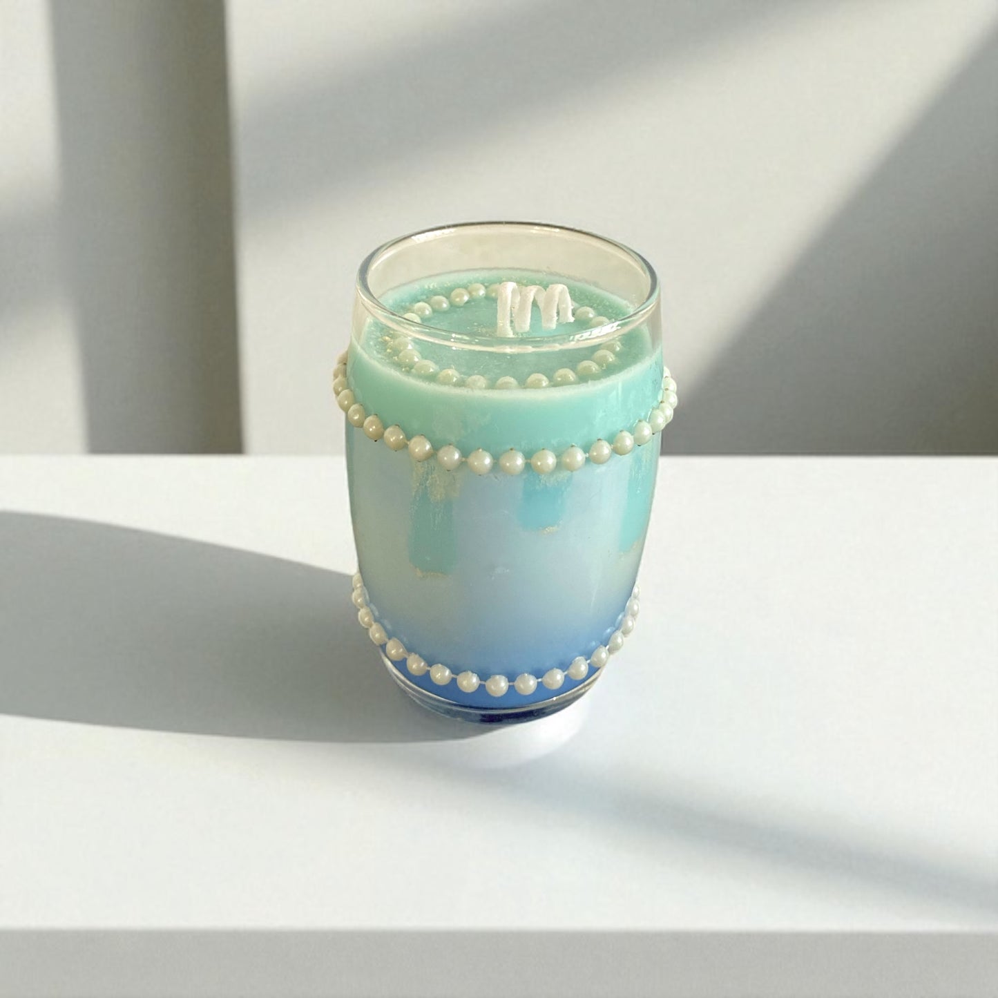 Vela turquesa perlada